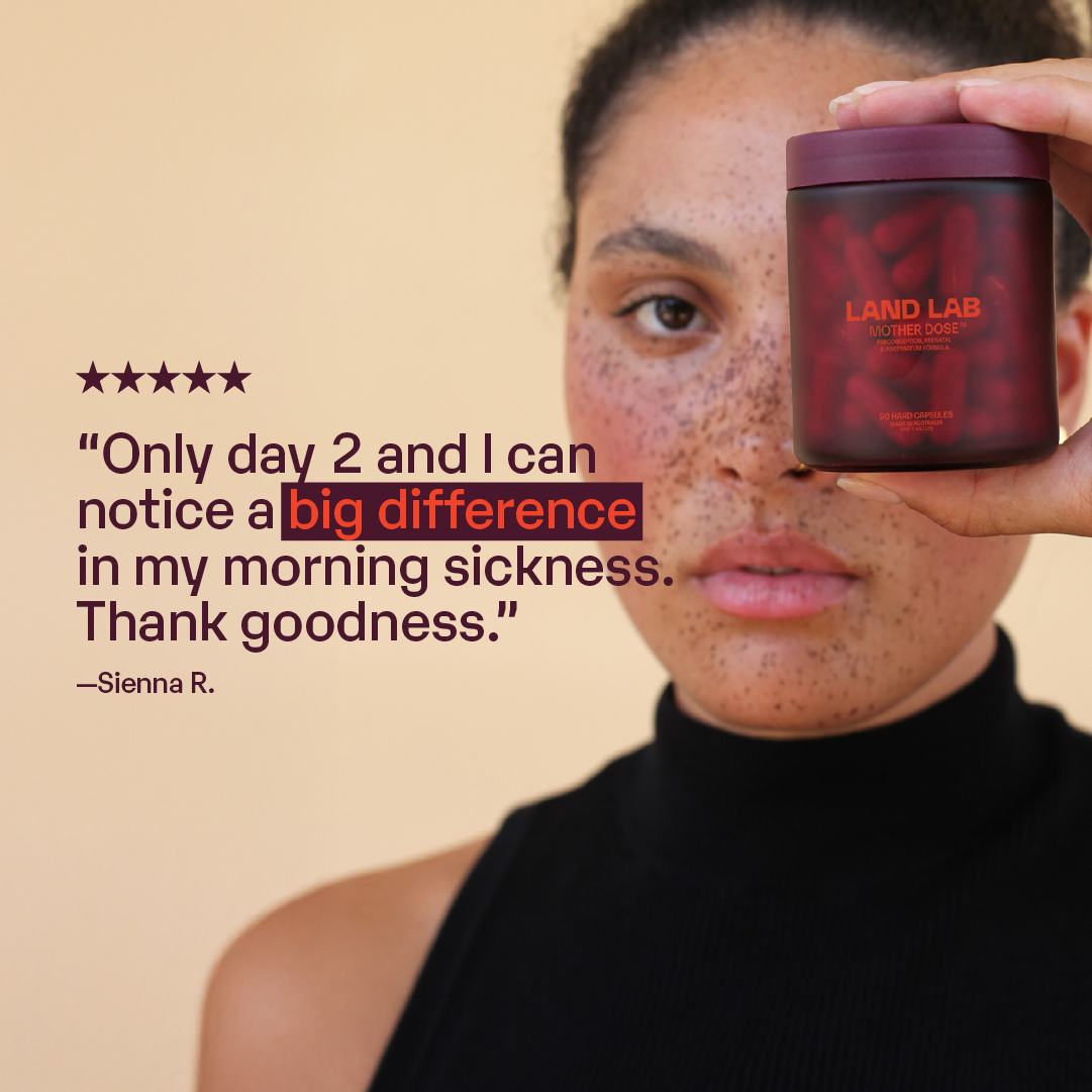 Woman holding Land Lab Mother Dose prenatal multivitamin jar, representing real customer feedback about reduced morning sickness after two days of use.